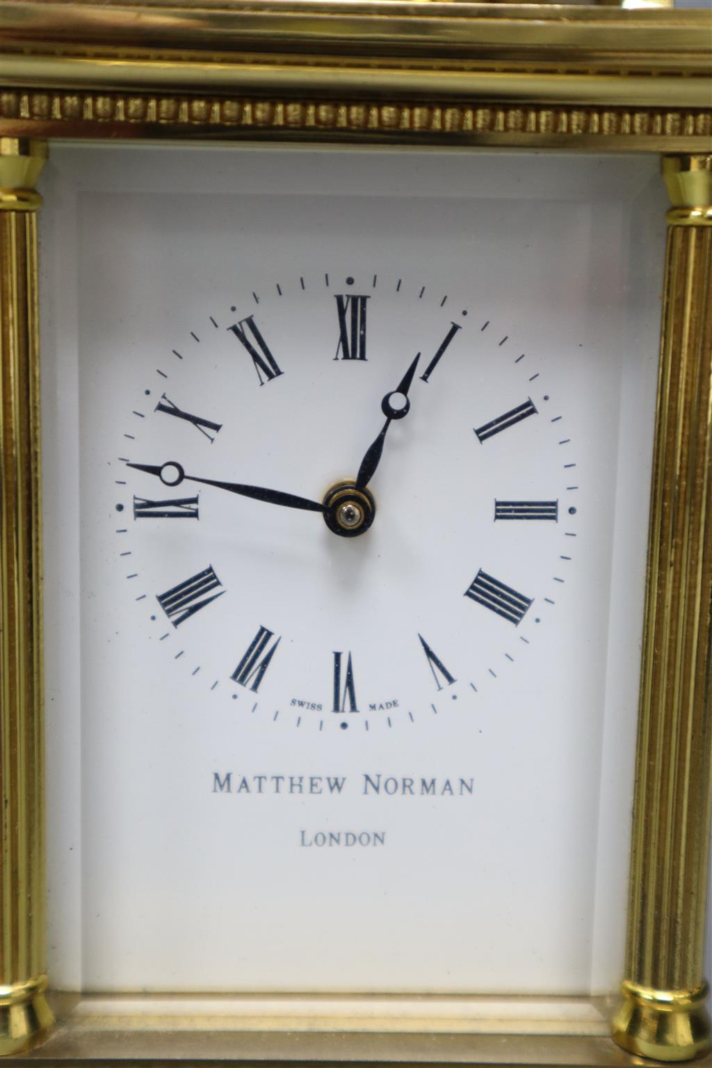 A Matthew Norman brass cased carriage timepiece, serial no.1754, height with handle down 13cm